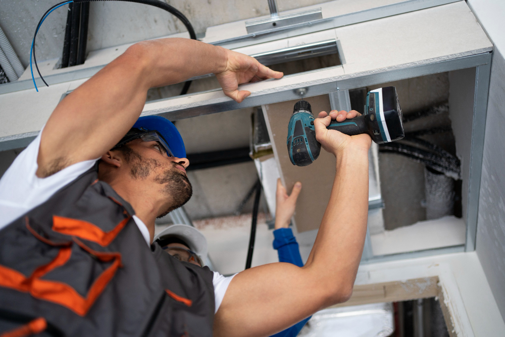 Technician installing a fire alarm system – Excel Electric Co.